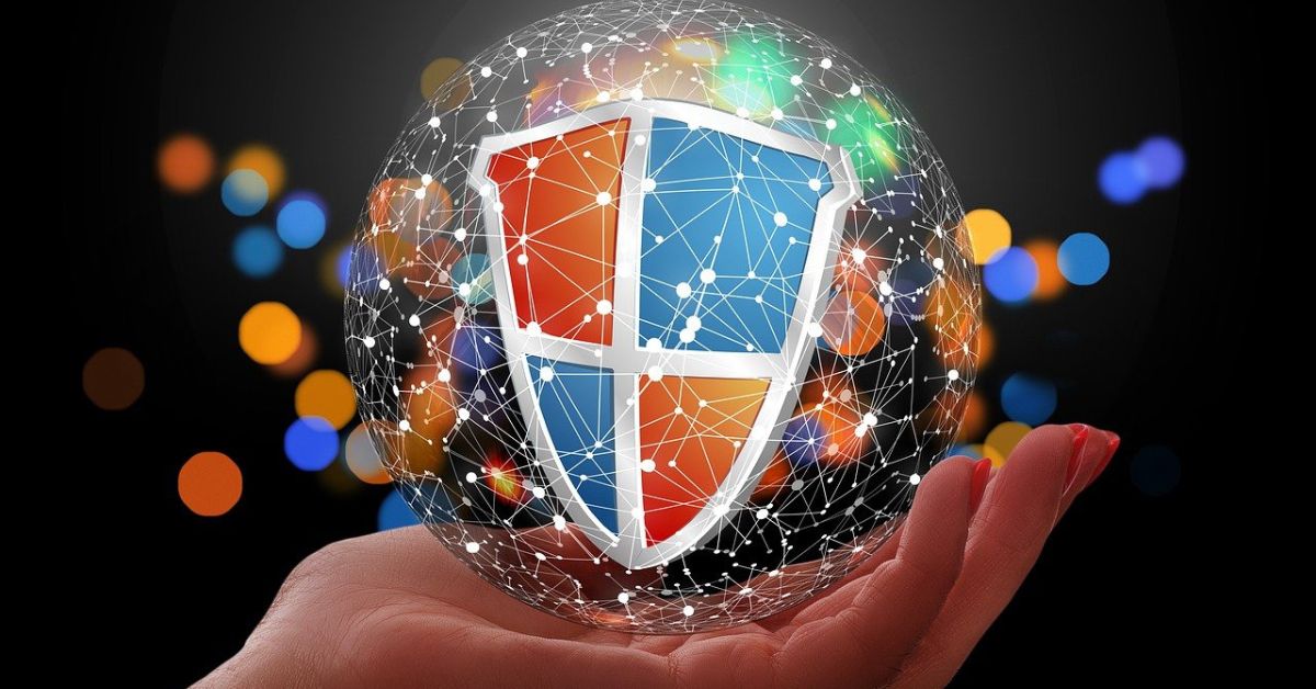Graphic of hand holding a shield surrounded by a digital network